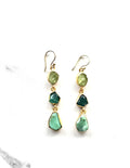 Pair of green gemstone earrings on a white background